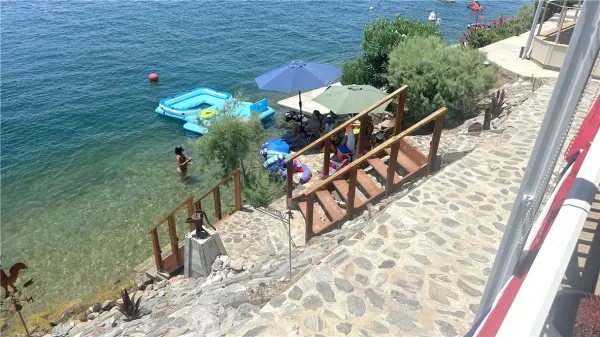 a backyard of a house with sofas