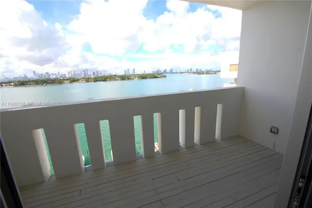 a view of wooden floor and lake from a roof