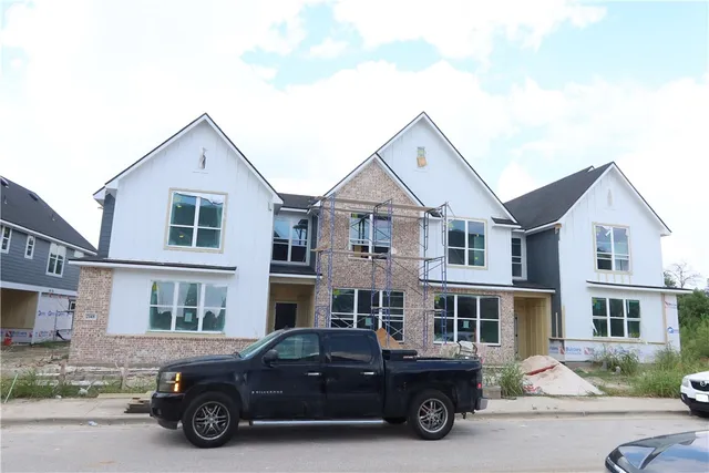 a car parked in front of a house