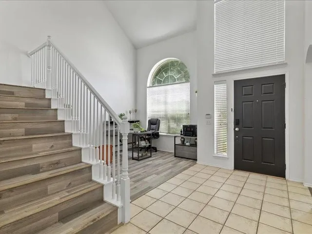 a view of entryway and hall with dining room