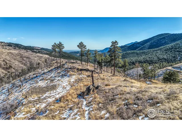 a open area with mountains in the background