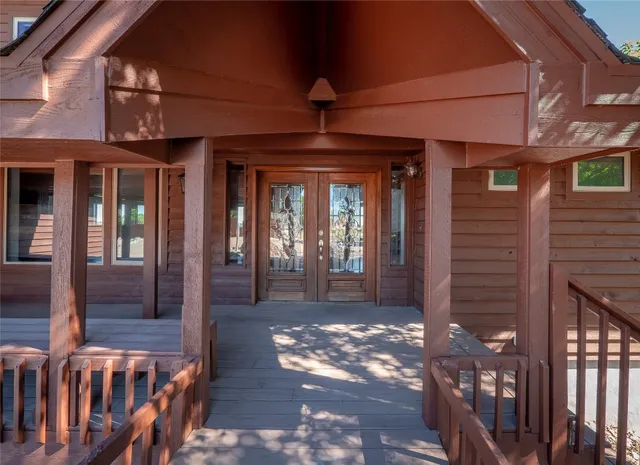 a view of a porch with a glass door