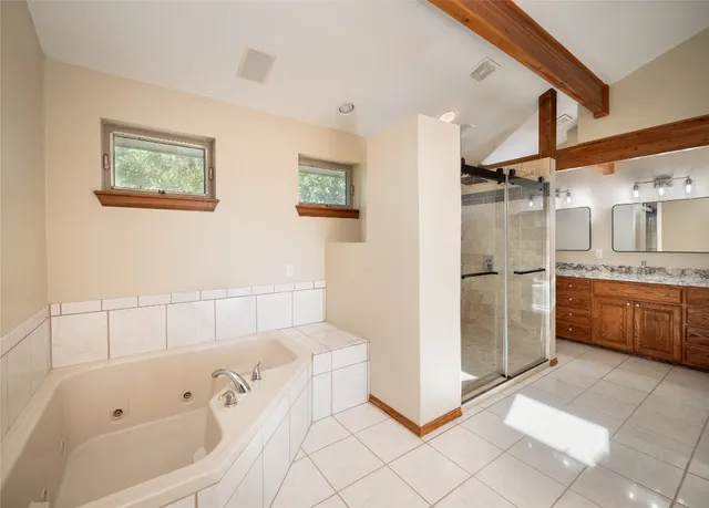 a bathroom with a sink vanity and mirror