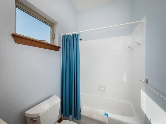 a bedroom with a bed and closet