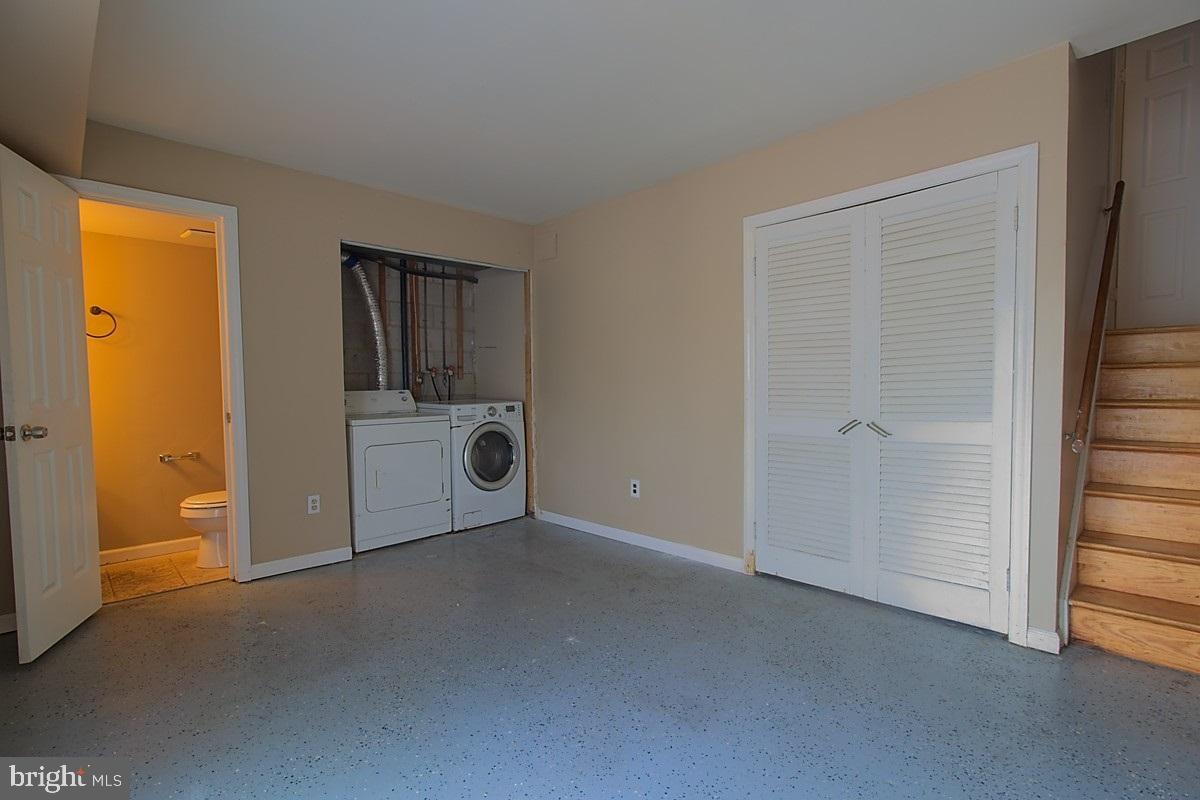 9054 Canterbury Riding, Unit 147 Laurel, MD 20723 - Photo 13 of 15 a view of a room that has a sink and cabinets