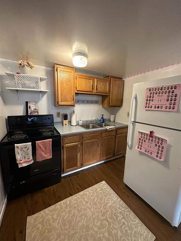 250-256 South 7th Street Indiana, PA 15701 - Photo 11 of 19 a kitchen with a stove and a refrigerator