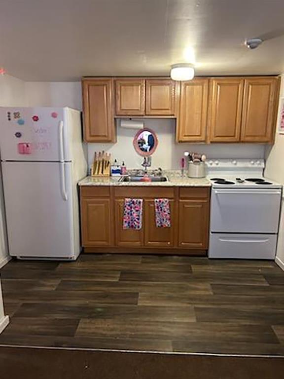 250-256 South 7th Street Indiana, PA 15701 - Photo 12 of 19 a kitchen with granite countertop a stove and a refrigerator