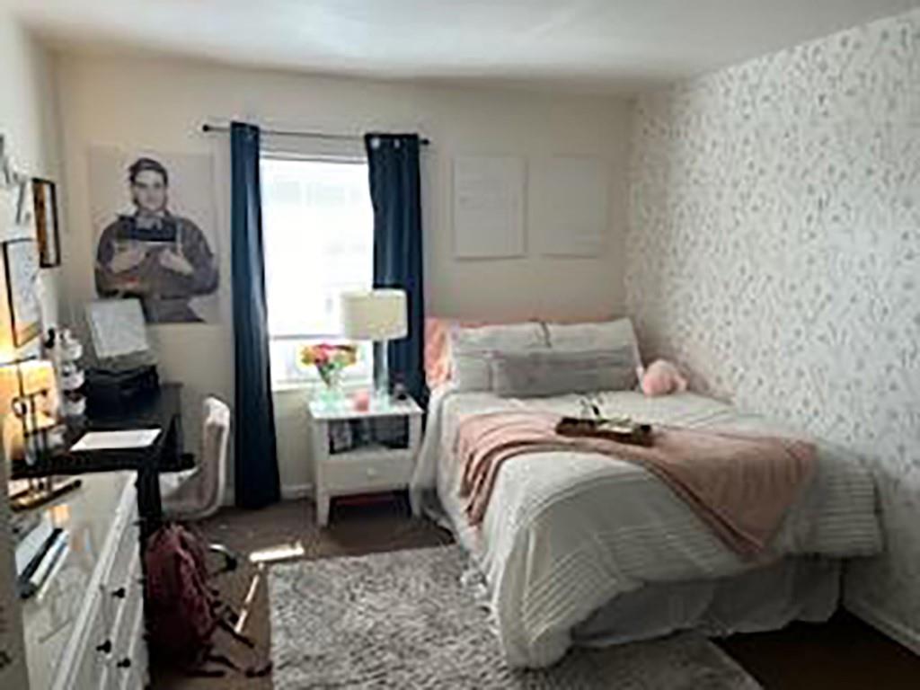 250-256 South 7th Street Indiana, PA 15701 - Photo 15 of 19 a bedroom with a bed and wooden floor