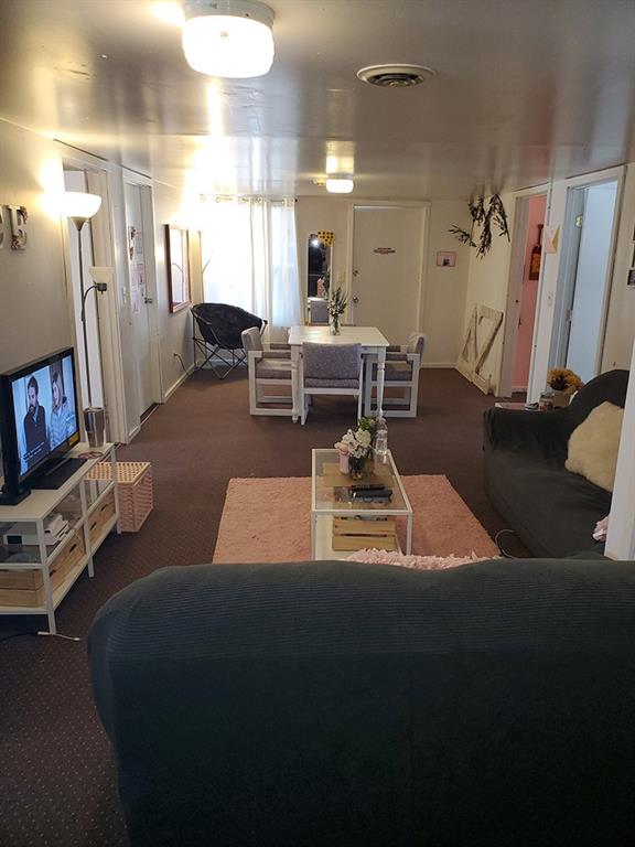250-256 South 7th Street Indiana, PA 15701 - Photo 3 of 19 a living room with furniture and a flat screen tv