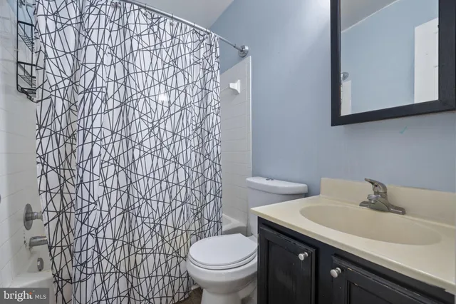 a bathroom with a toilet and a sink