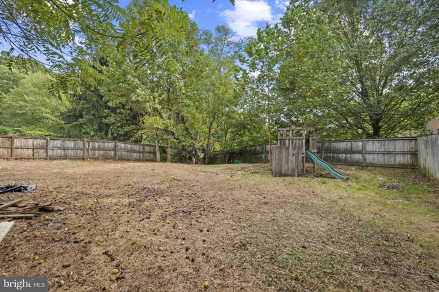 a backyard of a house with a trees