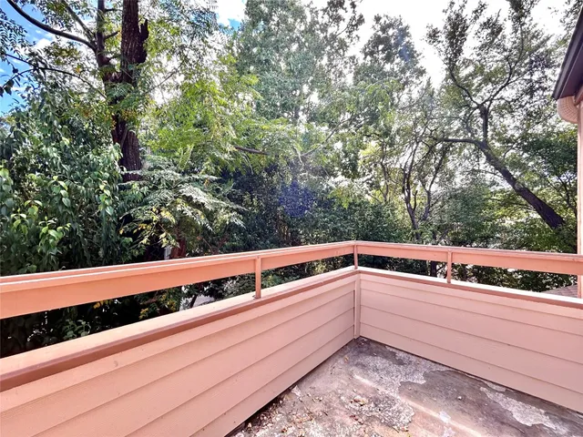 a white toilet sitting next to a bath tub and a shower