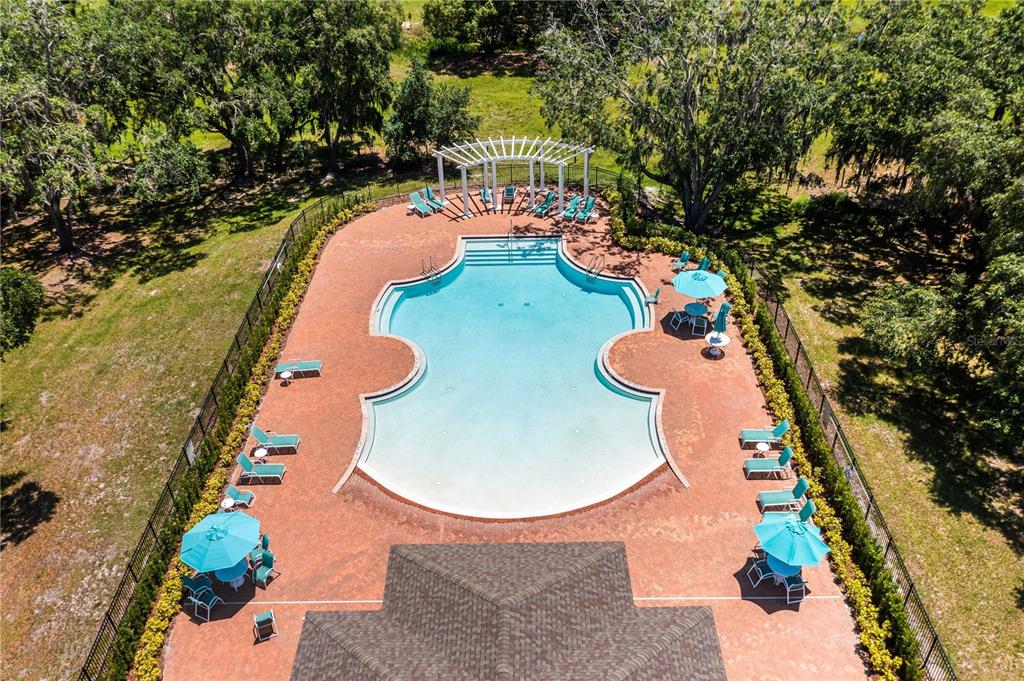 5637 Beggs Road St. Cloud, FL 34771 - Photo 31 of 35 an aerial view of a house with swimming pool and patio