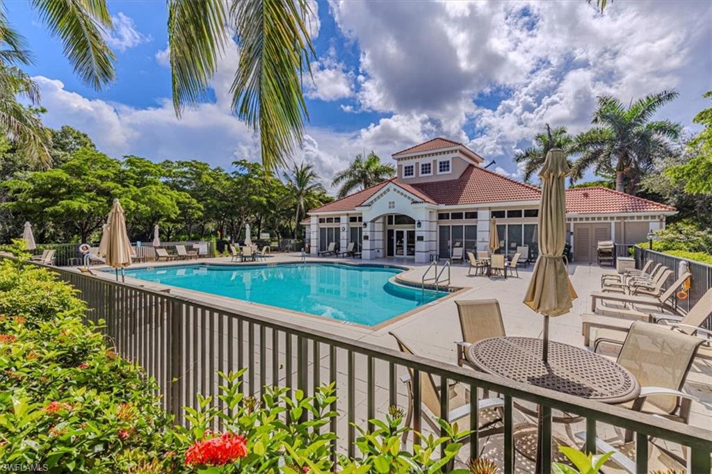 7837 Hawthorne Drive, Unit 1102 Naples, FL 34113 - Photo 28 of 33 Community pool featuring a patio area