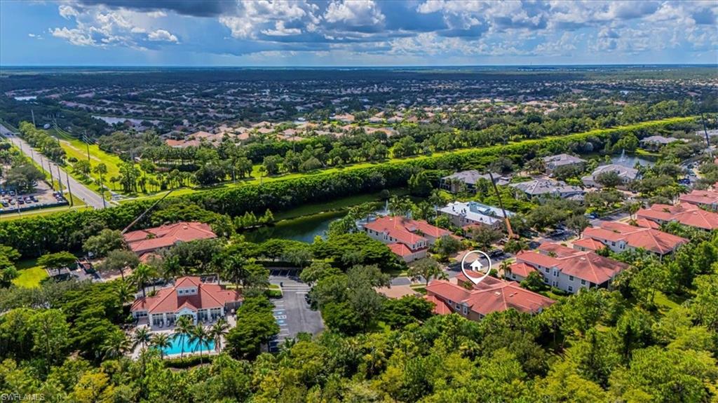 7837 Hawthorne Drive, Unit 1102 Naples, FL 34113 - Photo 31 of 33 Aerial view of residential area featuring a pool