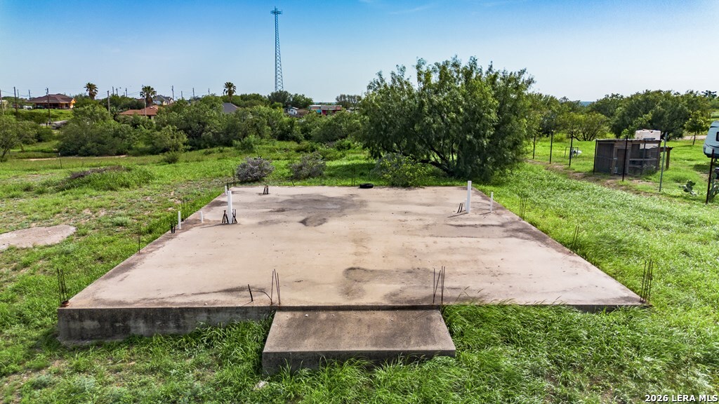 1326 Wagon Wheel Road Eagle Pass, TX 78852 - Photo 16 of 17 a backyard of a house with lots of green space
