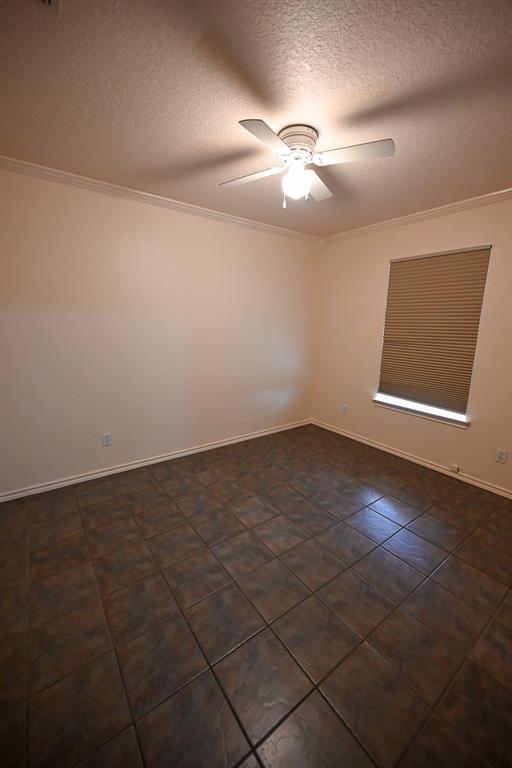3201 South Garland Street Decatur, TX 76234 - Photo 6 of 20 an empty room with a empty space and chandelier fan