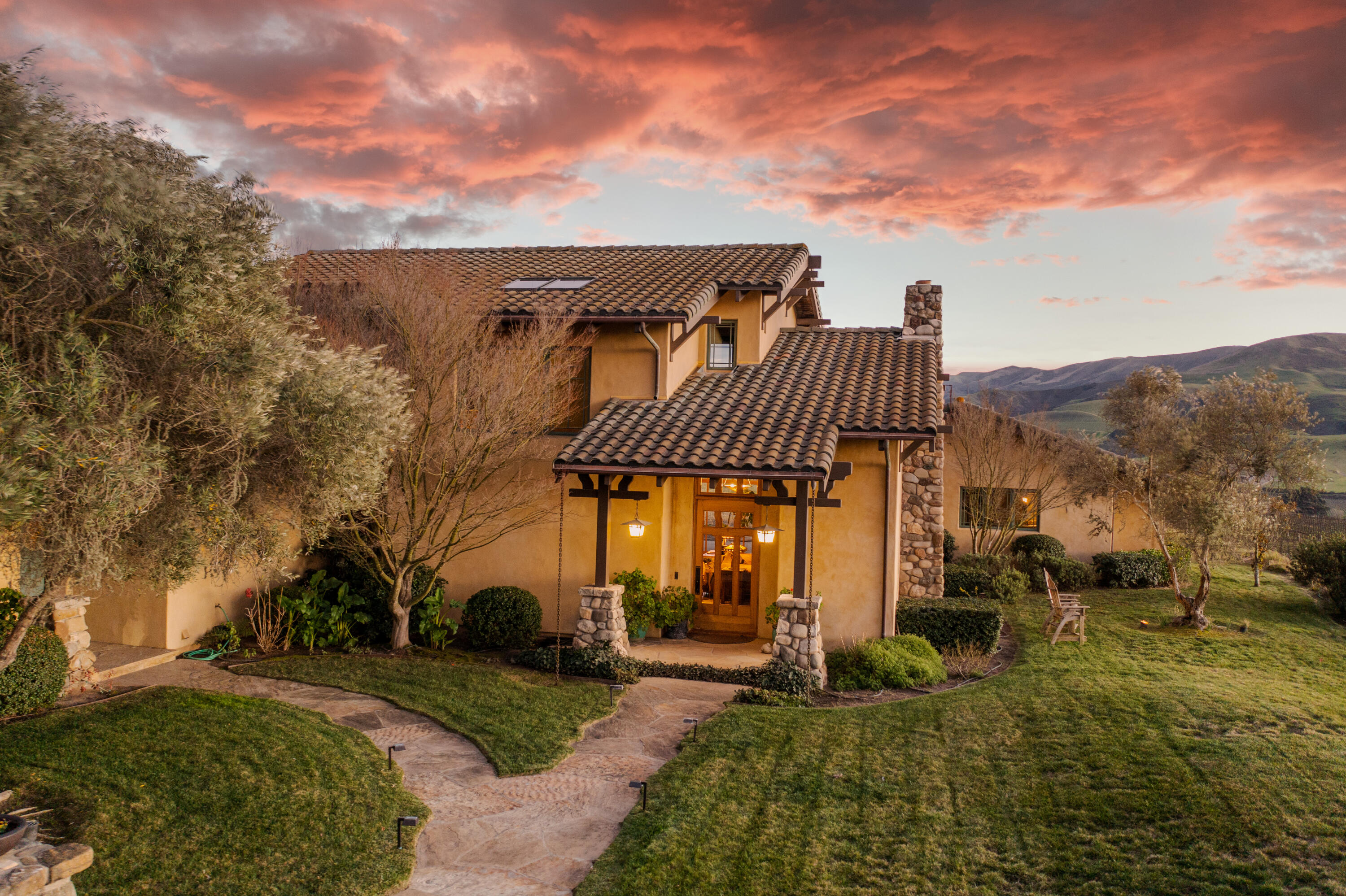 7320 Santos Lompoc, CA 93436 - Photo 2 of 37 a view of a house with a yard and table and chairs under an umbrella