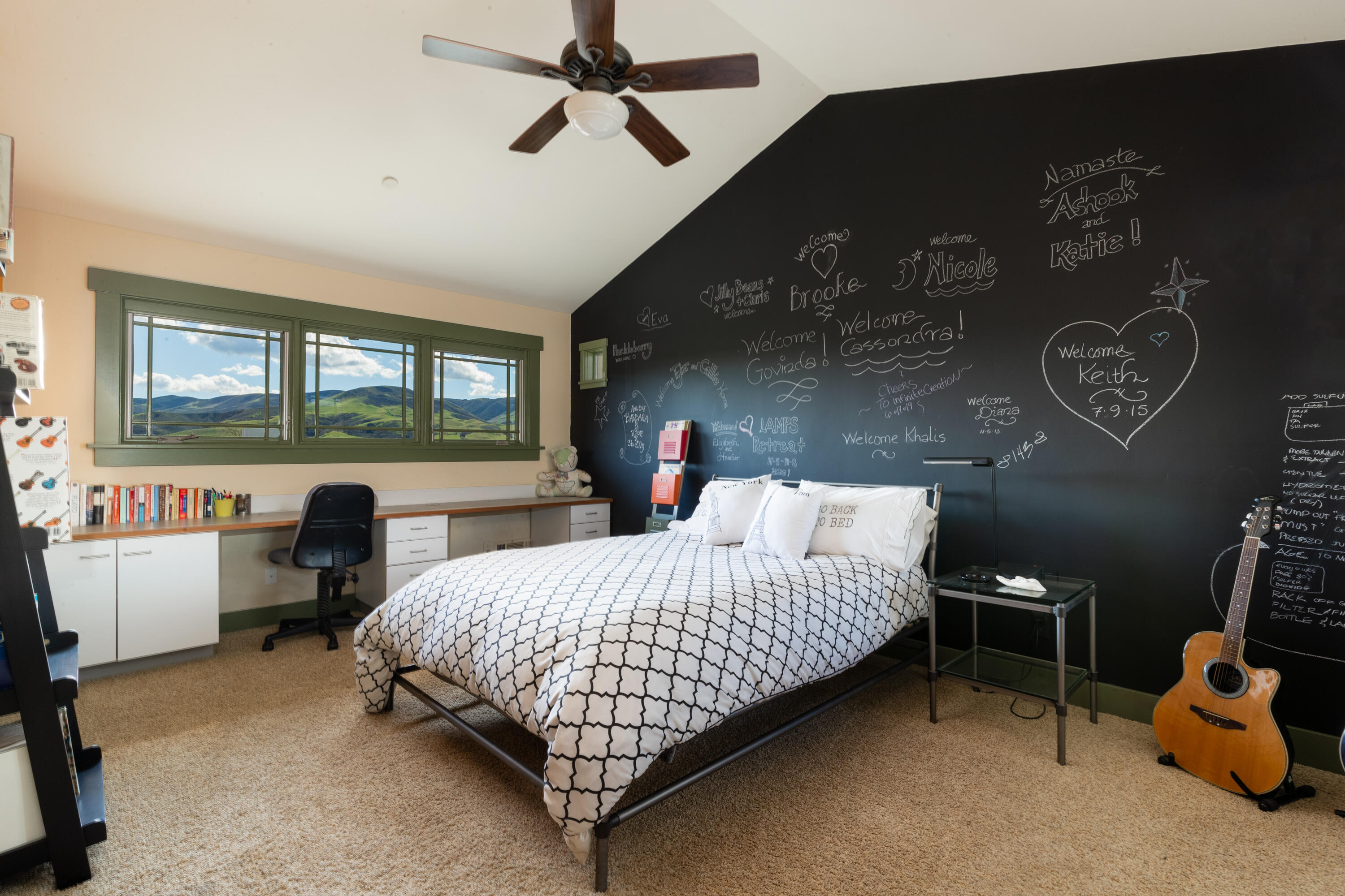 7320 Santos Lompoc, CA 93436 - Photo 22 of 37 a bedroom with a bed a chair and a chandelier