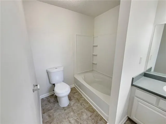 a bathroom with a sink vanity and mirror