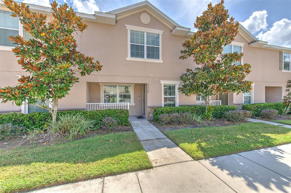 front view of a house with a yard