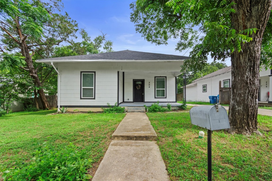 View of front of house featuring covered porch