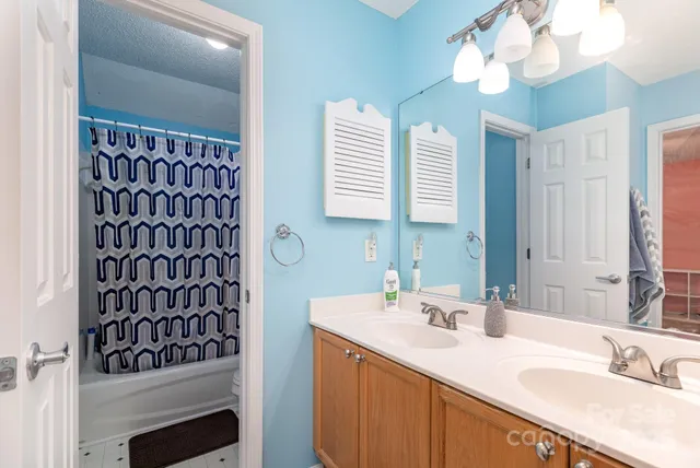a bathroom with a sink a vanity and a mirror