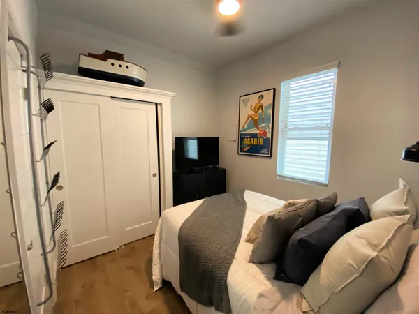 a bed room with a bed and a window