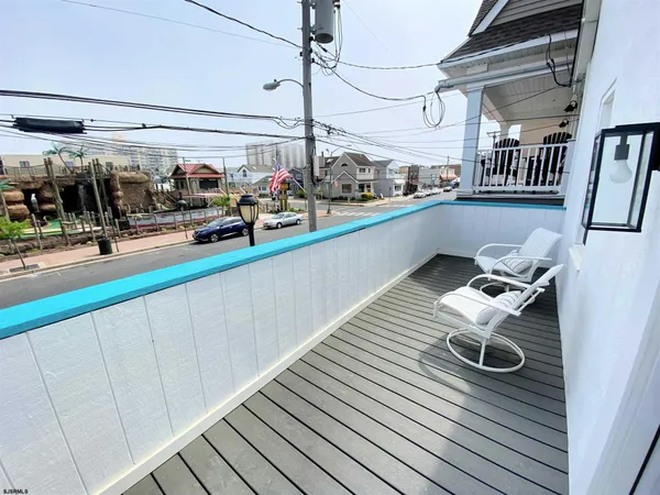 a view of swimming pool with outdoor seating