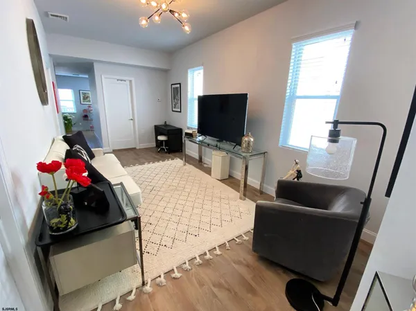 a bedroom with bed and flat screen tv