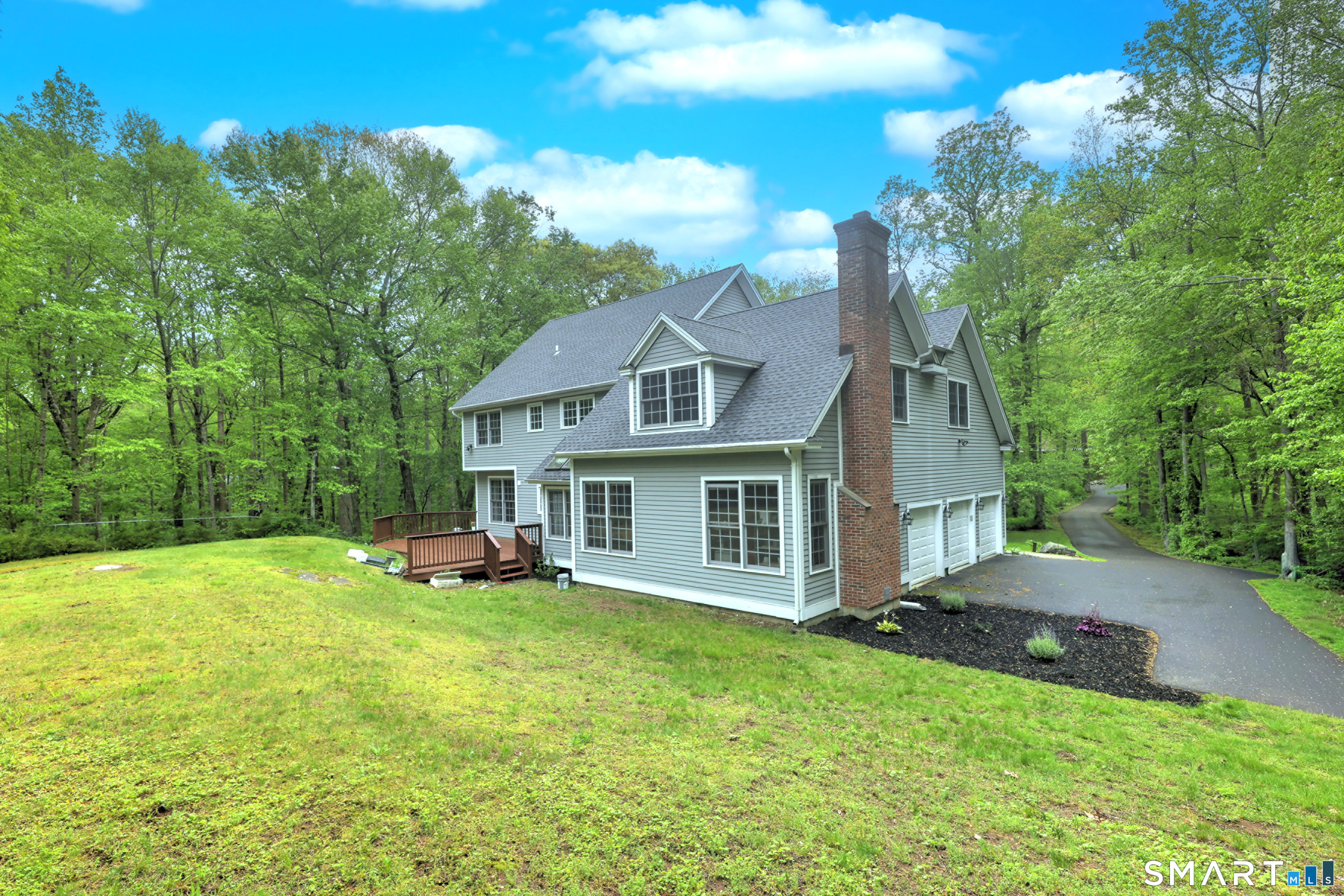 125 Peck Hill Road Woodbridge, CT 06525 - Photo 38 of 40 a view of a house with a yard