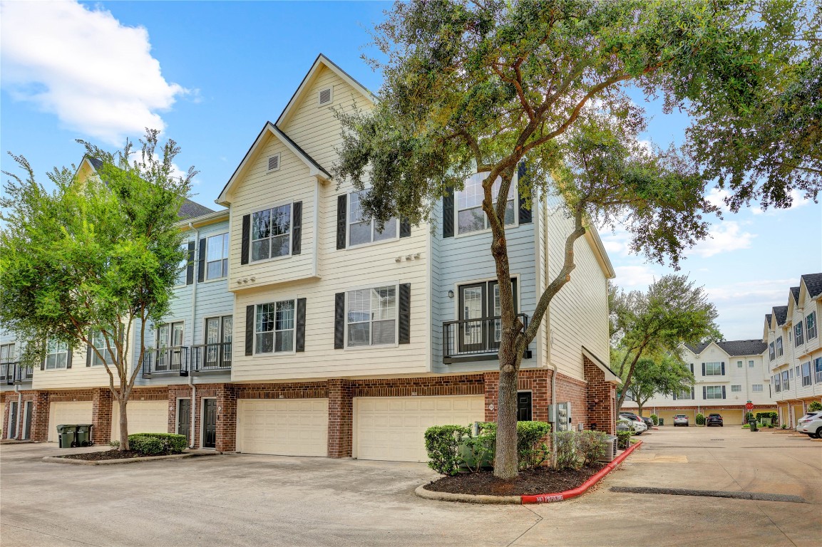 Lovely, move in ready corner townhome in gated enclave.
