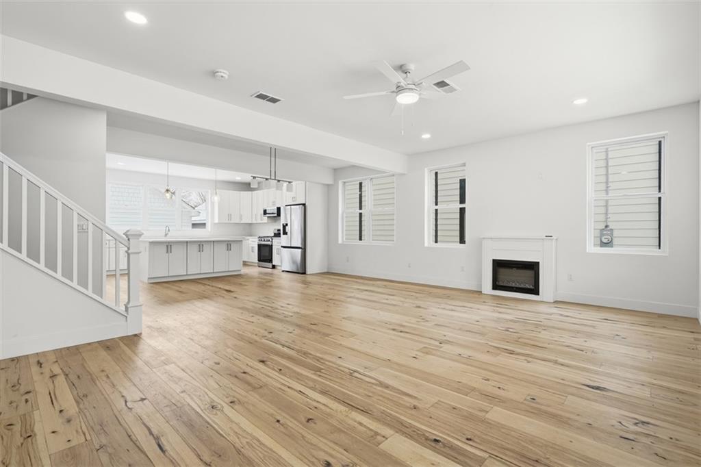 211 Green Street Pittsburgh, PA 15221 - Photo 14 of 22 a view of a livingroom with an empty space and a fireplace