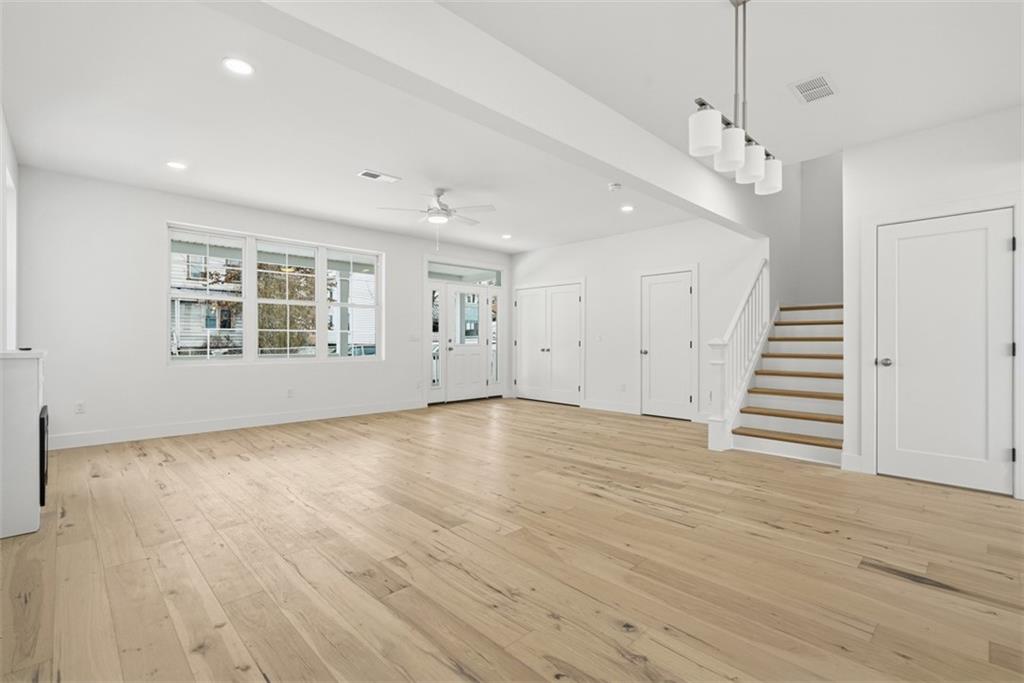 211 Green Street Pittsburgh, PA 15221 - Photo 18 of 22 an empty room with wooden floor and windows