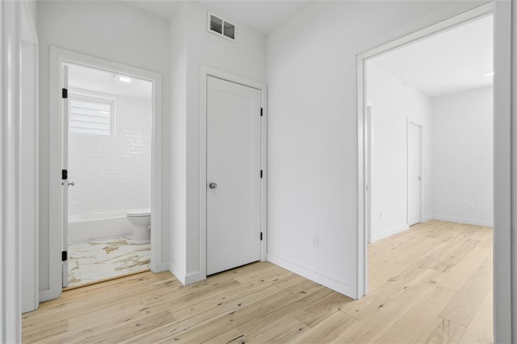 211 Green Street Pittsburgh, PA 15221 - Photo 20 of 22 a view of hallway with wooden floor
