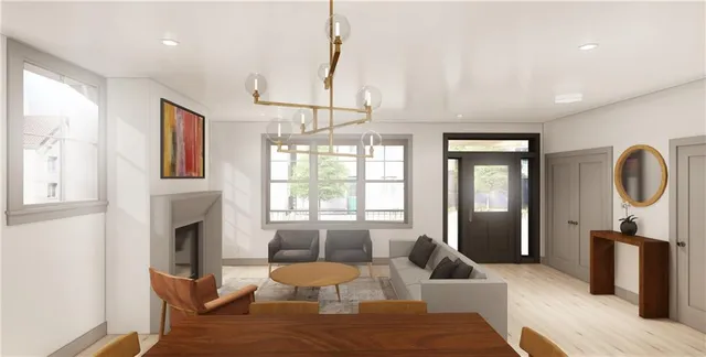 a living room with furniture a window and a chandelier