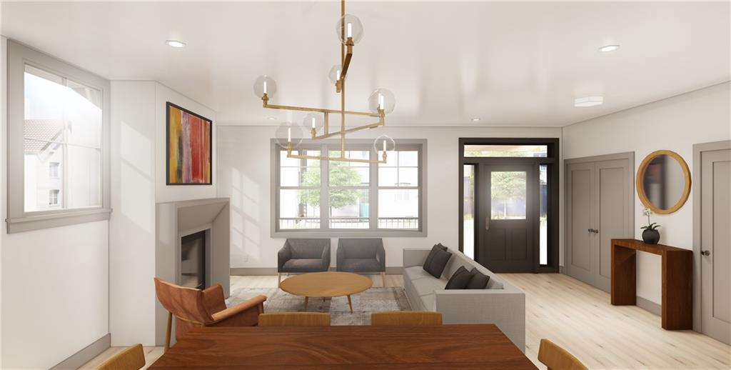 211 Green Street Pittsburgh, PA 15221 - Photo 3 of 22 a living room with furniture a window and a chandelier