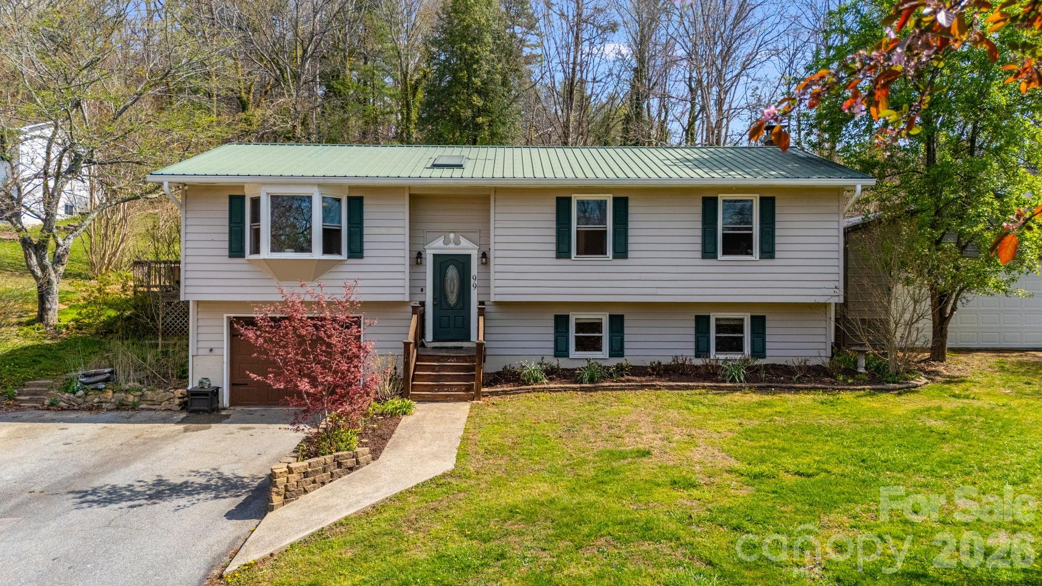 99 South Rowe Road Hendersonville, NC 28792 - Photo 2 of 40 a view of house with yard outdoor seating and yard