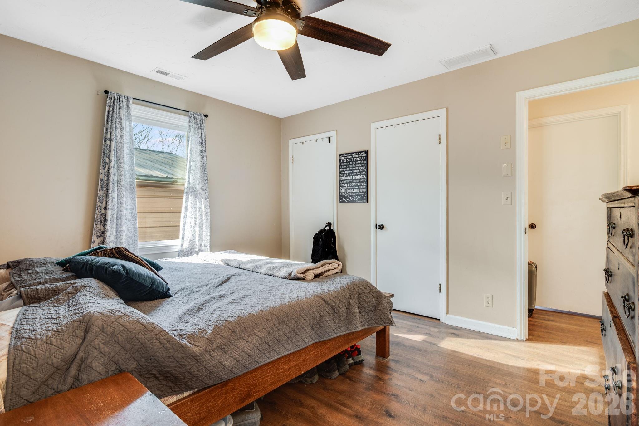 99 South Rowe Road Hendersonville, NC 28792 - Photo 24 of 40 a bedroom with a bed and a window