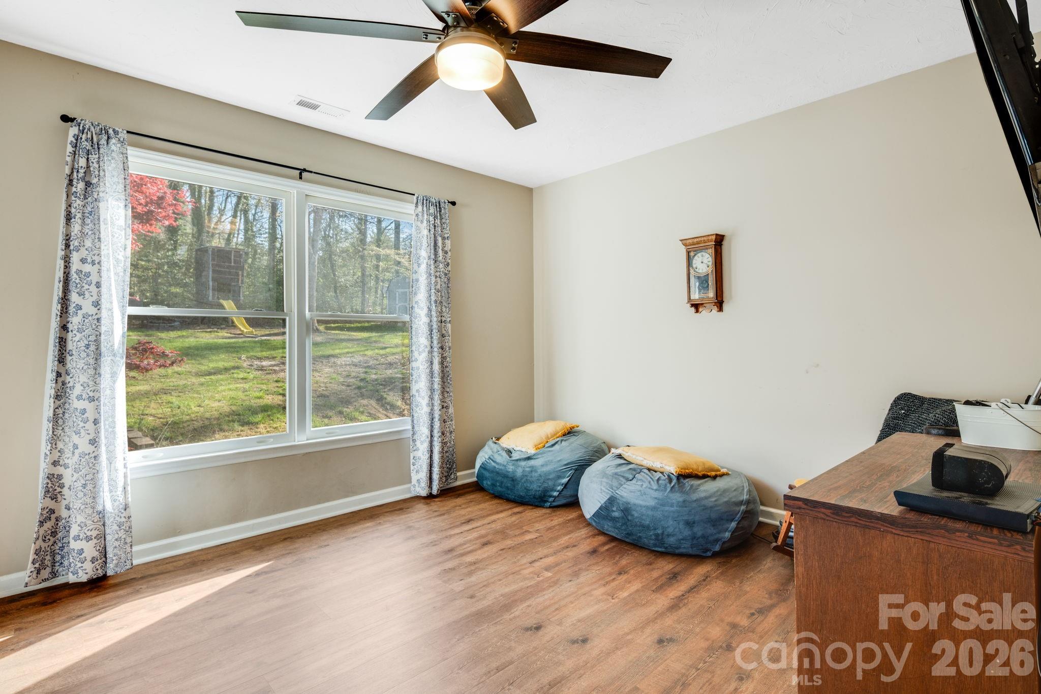 99 South Rowe Road Hendersonville, NC 28792 - Photo 26 of 40 a bedroom with a bed and window