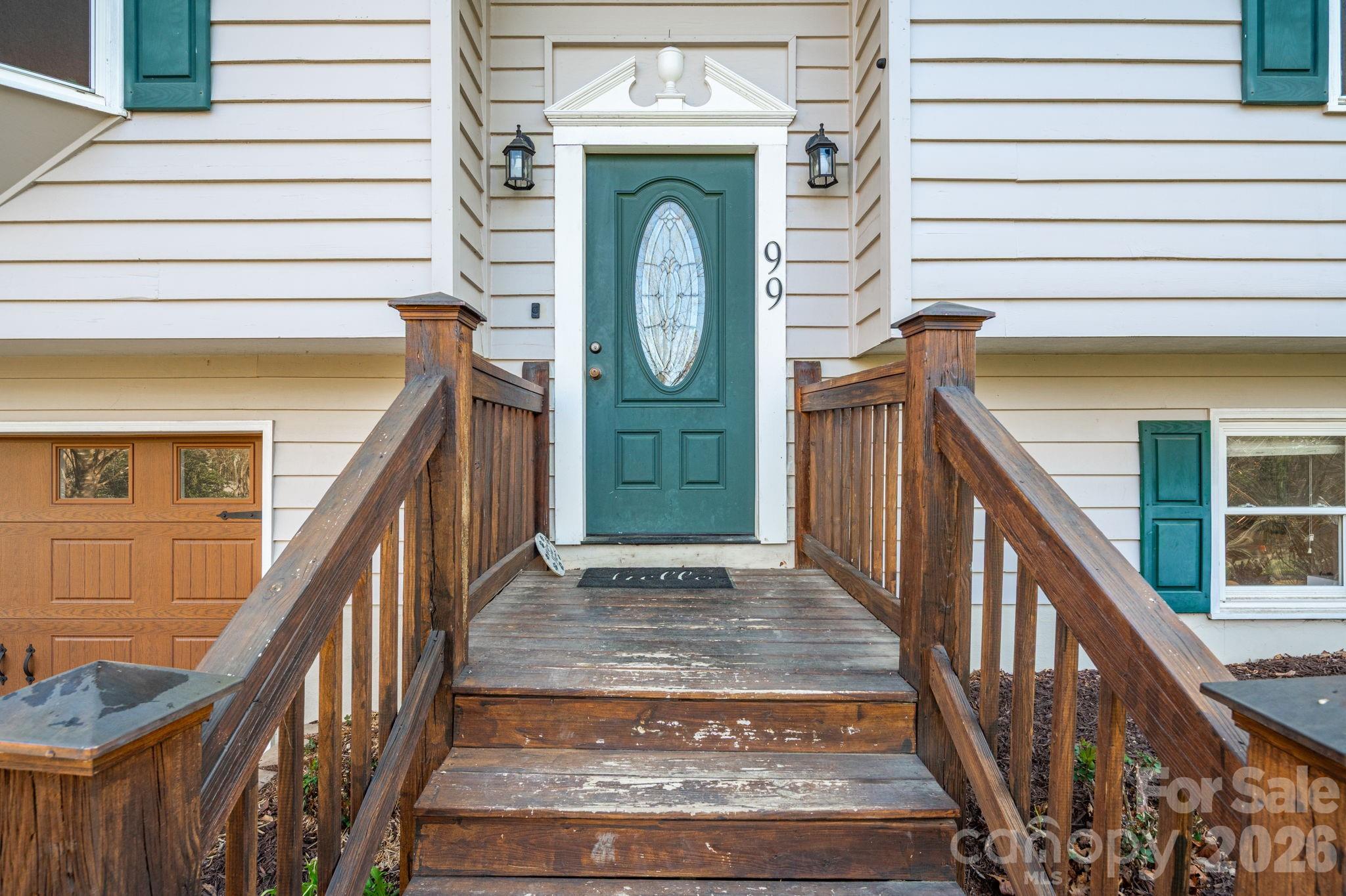 99 South Rowe Road Hendersonville, NC 28792 - Photo 3 of 40 a view of a entryway door with wooden floor
