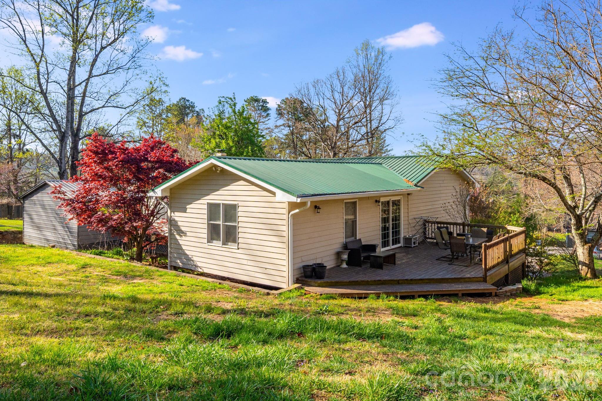 99 South Rowe Road Hendersonville, NC 28792 - Photo 35 of 40 a front view of house with yard and seating area