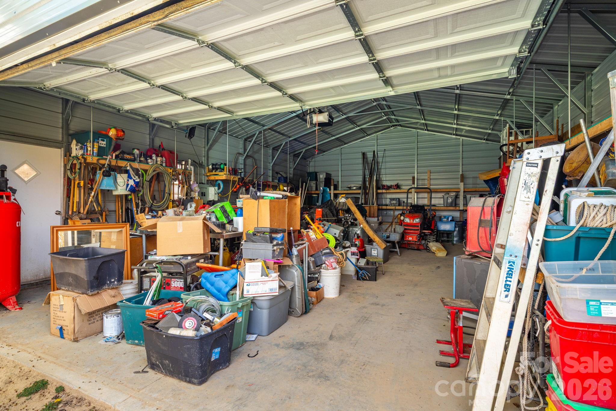 99 South Rowe Road Hendersonville, NC 28792 - Photo 37 of 40 a view of a storage room with a lot of stuff