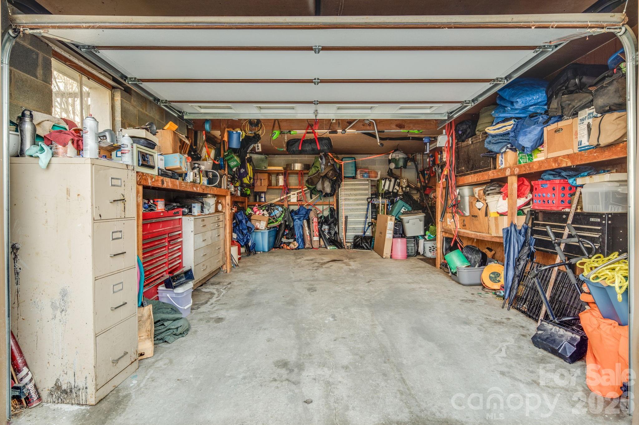 99 South Rowe Road Hendersonville, NC 28792 - Photo 38 of 40 a view of a storage room with a lot of stuff