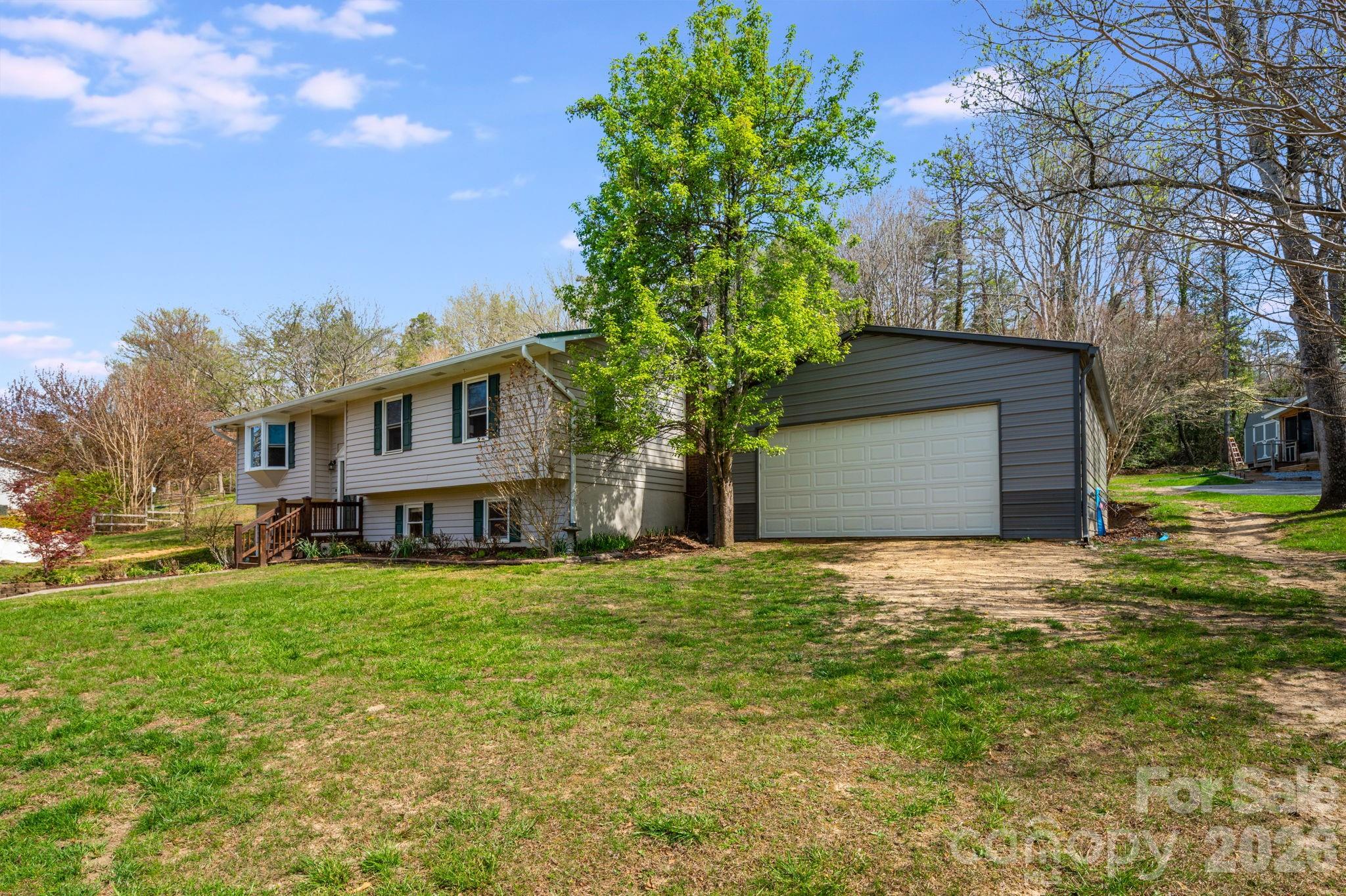 99 South Rowe Road Hendersonville, NC 28792 - Photo 40 of 40 a house view with a garden space