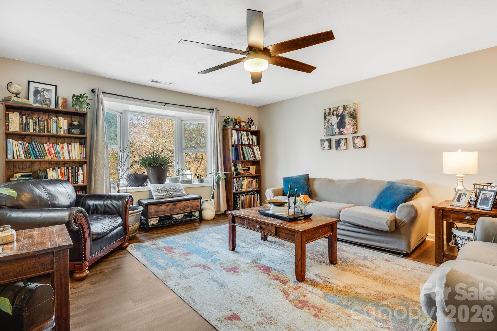 99 South Rowe Road Hendersonville, NC 28792 - Photo 5 of 40 a living room with furniture and a large window
