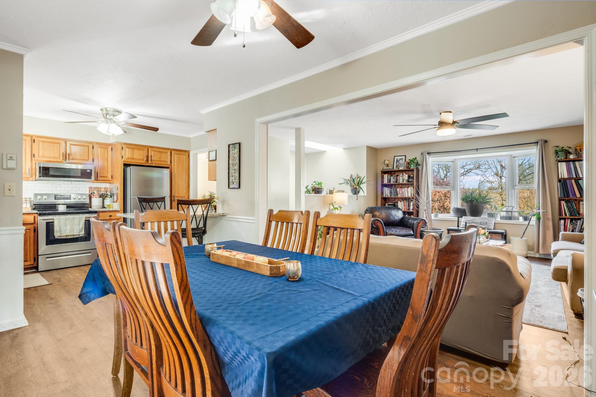 99 South Rowe Road Hendersonville, NC 28792 - Photo 8 of 40 a view of a dining room with furniture