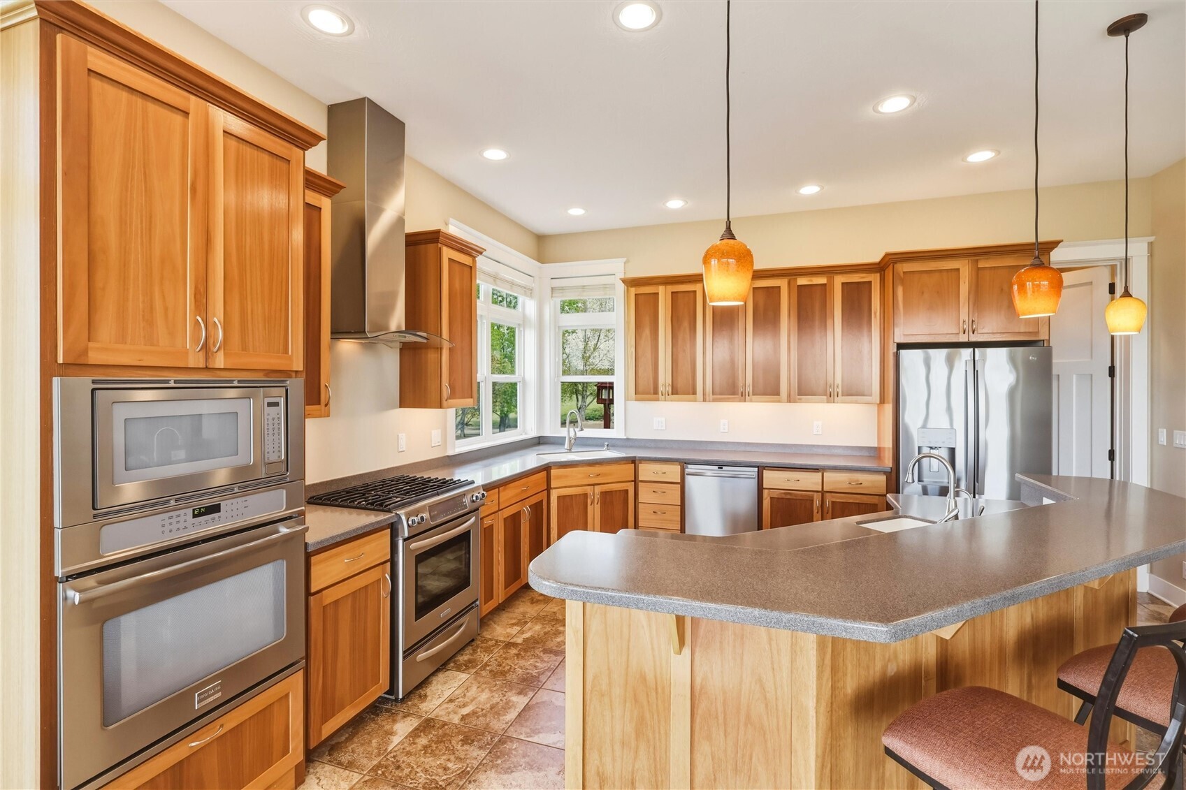 167 Rawhide Road Walla Walla, WA 99362 - Photo 11 of 40 a kitchen with stainless steel appliances granite countertop a stove a sink and a refrigerator