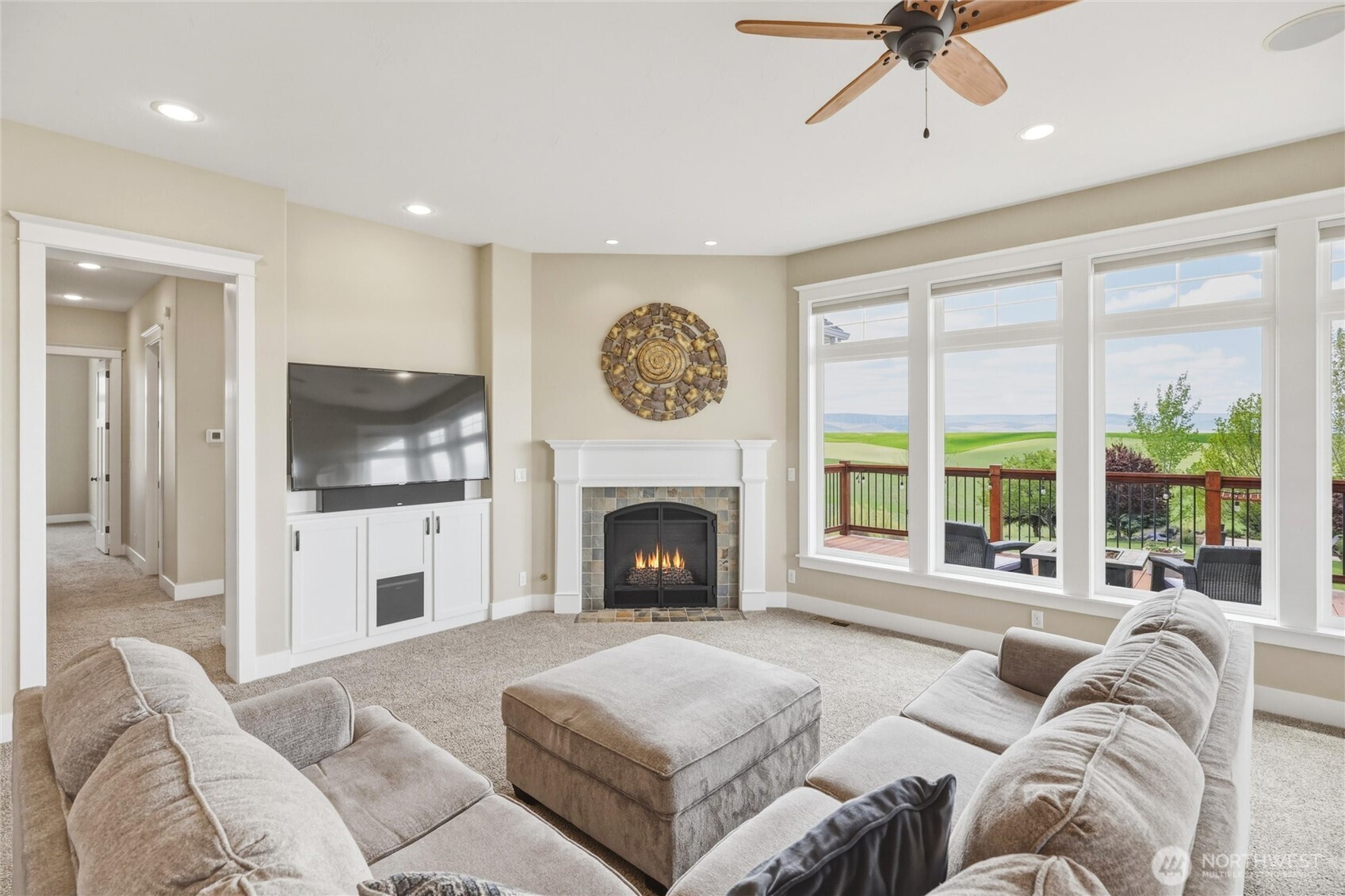 167 Rawhide Road Walla Walla, WA 99362 - Photo 13 of 40 a living room with furniture a fireplace and a flat screen tv