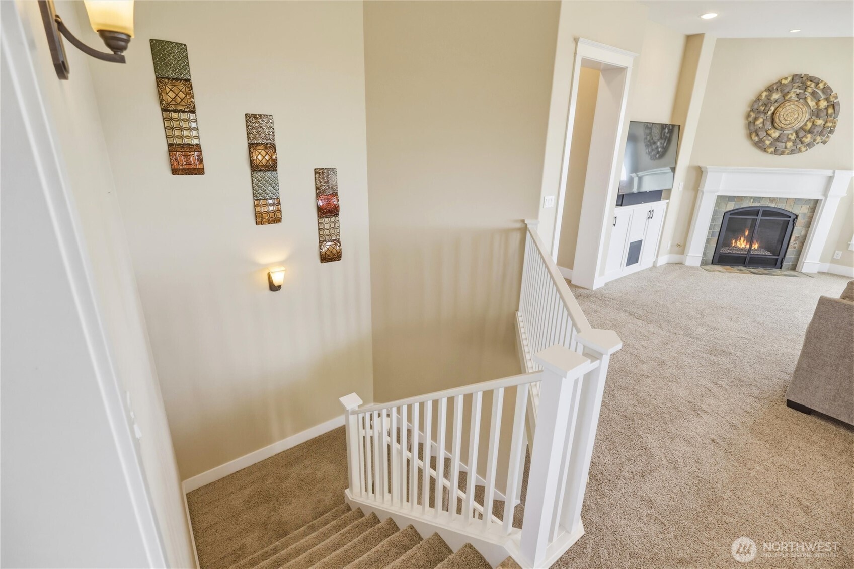 167 Rawhide Road Walla Walla, WA 99362 - Photo 24 of 40 a view of a hallway to a bedroom with wooden floor and a fireplace